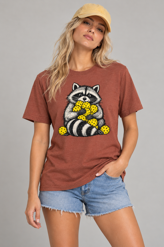 Model wearing Pickleball Ball Hoarder Raccoon T-Shirt
