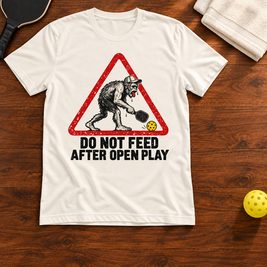 Do Not Feed After Open Play Pickleball T-Shirt, vintage-white, warm wood flat lay