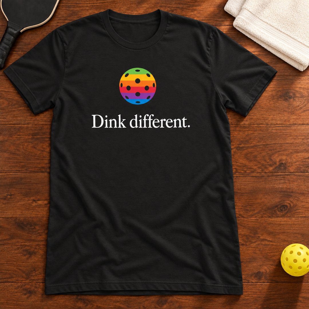 Dink Different Retro Rainbow Pickleball T-Shirt, vintage-black, warm wood flat lay