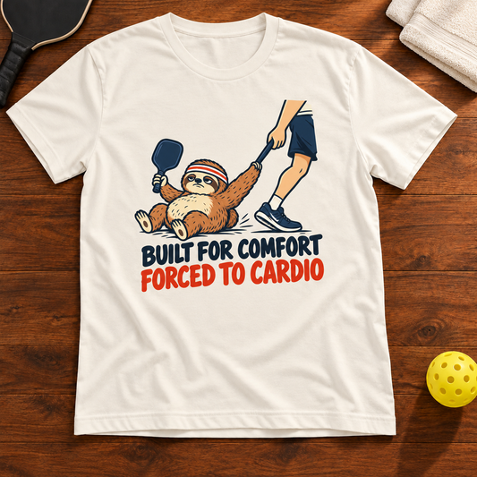 Built for Comfort Forced to Cardio Pickleball T-Shirt, vintage-white, warm wood flat lay